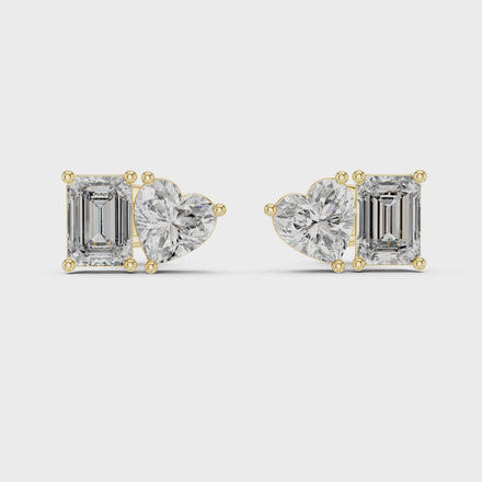 Heart and emerald cut diamond stud earrings in rose gold finish