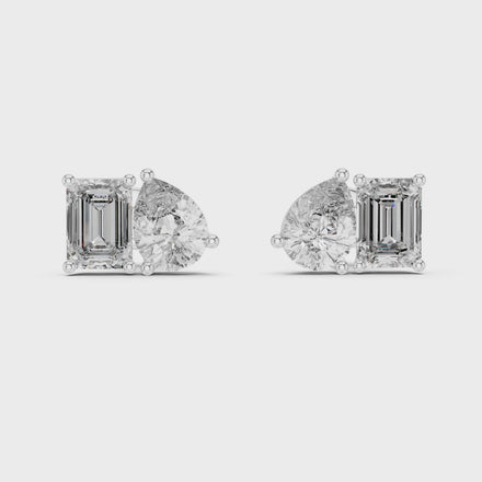 Pear and emerald cut diamond stud earrings in modern luxury design