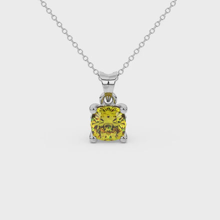 Yellow cushion cut solitaire gemstone pendant in gold with classic four prong setting