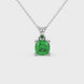 Green cushion cut gemstone solitaire pendant in gold featuring a refined four-prong basket setting