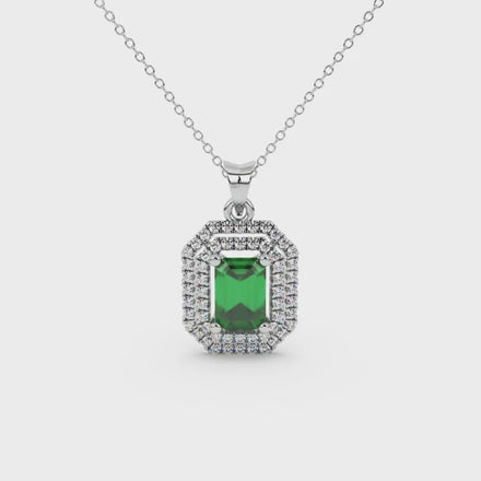 Emerald cut green gemstone double halo pendant with octagonal diamond frame in gold