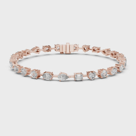 Multi shape lab grown diamond tennis bracelet with round heart oval pear and emerald cut diamonds in gold variations