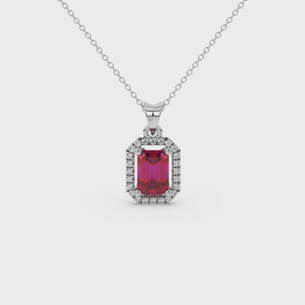 Emerald cut red gemstone halo pendant with round diamond accents