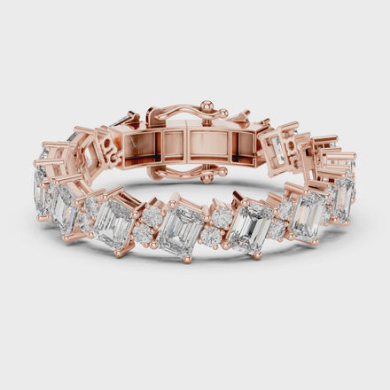 Luxury emerald cut diamond tennis bracelet in gold with round accent diamonds by Signora Jewels