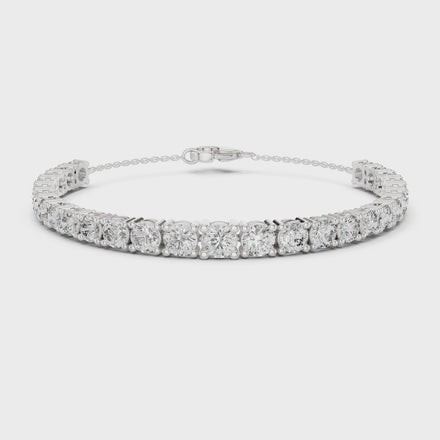Graduated lab grown diamond tennis bracelet in yellow gold white gold and rose gold with round brilliant diamond design