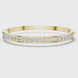 Channel set lab grown diamond bangle bracelet in yellow gold white gold and rose gold with sleek round diamond design