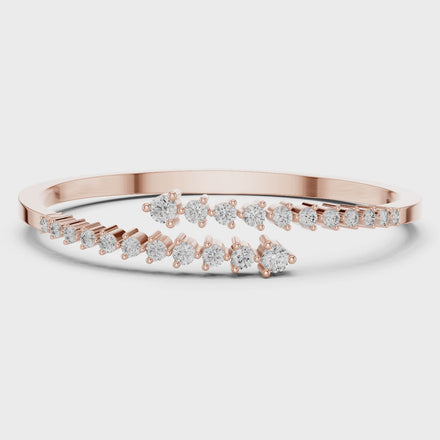 Graduated round lab grown diamond open cuff bracelet with flowing diamond design in yellow white and rose gold