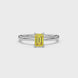 Emerald cut yellow gemstone ring featuring elegant solitaire setting