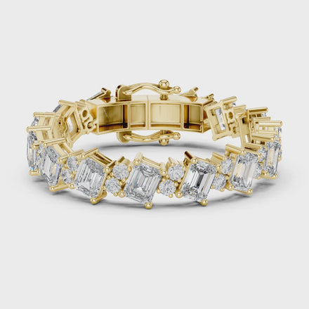 Luxury emerald cut diamond tennis bracelet in gold with round accent diamonds by Signora Jewels