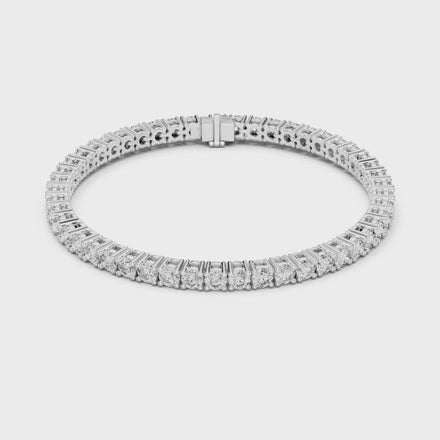 Classic round diamond tennis bracelet available in yellow gold white gold and rose gold with 49 brilliant diamonds in elegant collet setting design