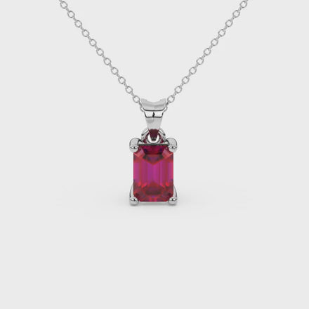 Emerald cut red gemstone solitaire pendant in white gold four prong setting