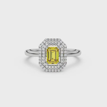 Emerald cut yellow gemstone double halo ring with octagonal diamond frame in gold