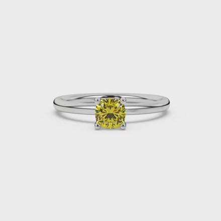 Yellow cushion cut solitaire gemstone ring with accent diamonds in rose gold four prong setting