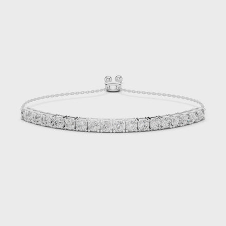 white gold bracelet with clear gemstones on a white background