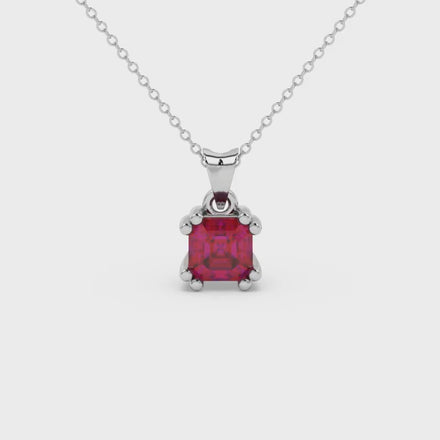 Red Asscher cut gemstone pendant in gold featuring a crown-inspired eight-prong solitaire setting