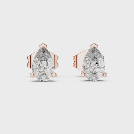 Pear cut solitaire diamond stud earrings in gold with lab grown diamonds