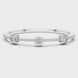 Elegant three stone round diamond bangle bracelet in gold with pavé accent diamonds by Signora Jewels