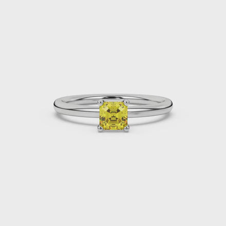 Yellow Asscher cut solitaire ring in gold featuring a 5.00 MM gemstone in a classic four-prong cathedral setting