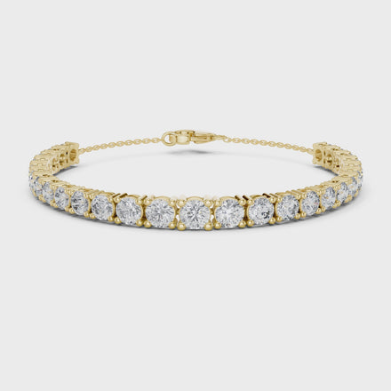 Graduated lab grown diamond tennis bracelet in yellow gold white gold and rose gold with round brilliant diamond design