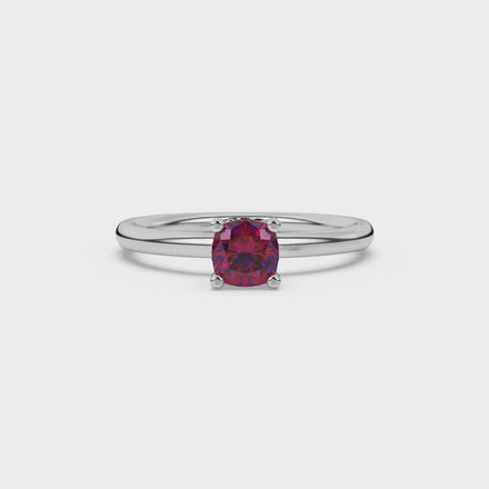 Red cushion cut gemstone ring with diamond gallery detailing in white gold
