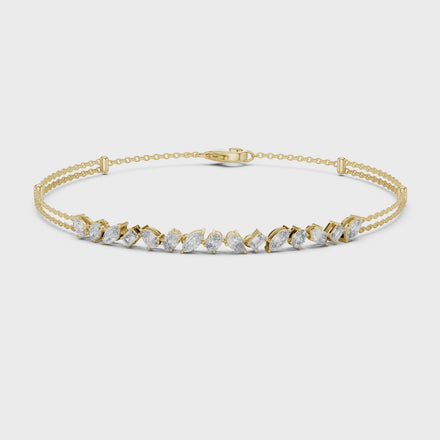 Contemporary multi shape lab grown diamond chain bracelet with pear oval marquise and emerald cut diamonds in yellow white and rose gold
