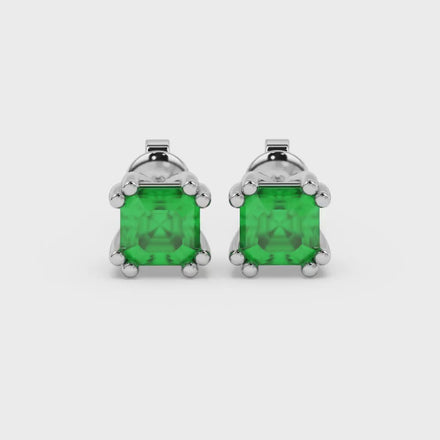 Green Asscher cut stud earrings in gold featuring a crown-inspired eight-prong setting and push back closure