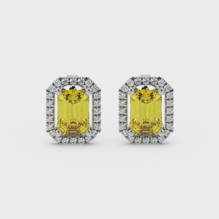 Emerald cut yellow gemstone halo stud earrings with round diamond accents