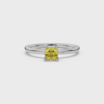 Asscher cut gemstone solitaire ring in gold with four-prong setting