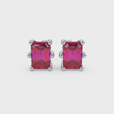 Emerald cut red gemstone solitaire stud earrings in gold with six prong setting