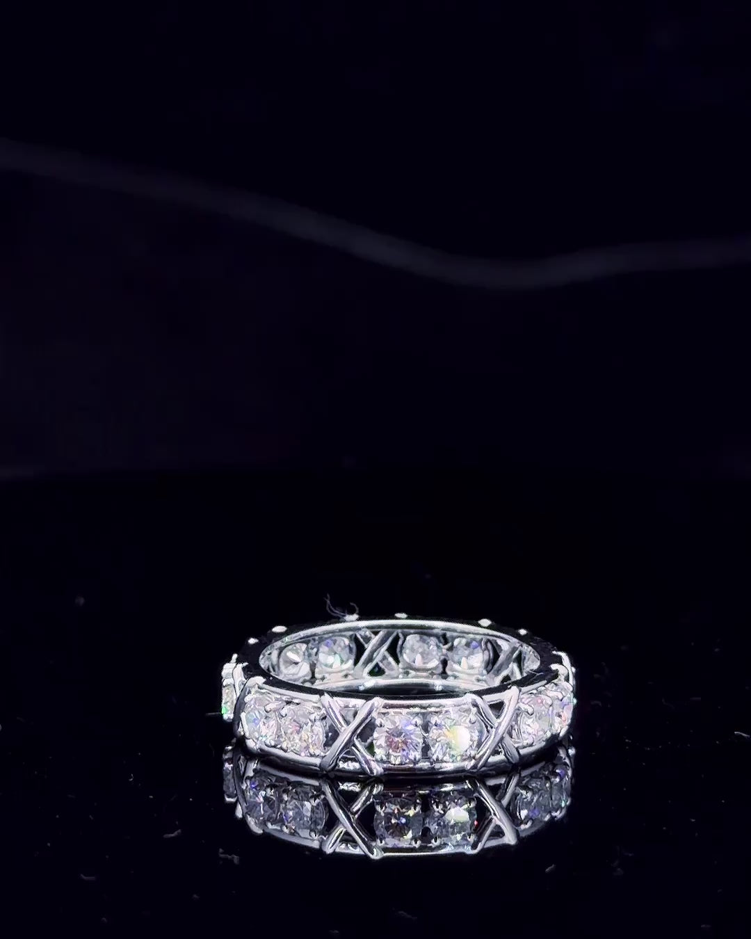 Main: White gold X-motif eternity ring with 1.40ct round lab grown diamonds on black
Detail: Close-up of round lab grown diamonds divided by sculptural white gold crossover X motifs
Side: White gold full eternity band showing round lab grown diamonds and repeating crossover details