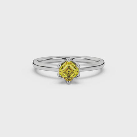 Asscher cut solitaire ring featuring a brilliant yellow gemstone secured in a six-prong crown setting crafted in gold