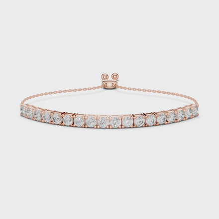 rose gold bracelet with clear gemstones on a white background