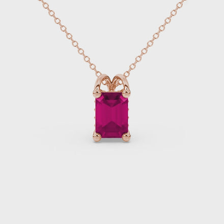 Emerald cut red gemstone solitaire pendant in rose gold four prong setting