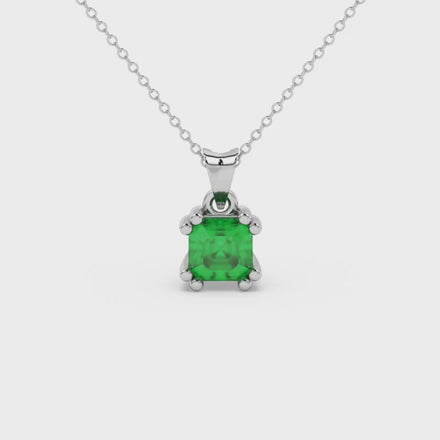 Green Asscher cut gemstone pendant in gold featuring a crown-inspired eight-prong solitaire setting