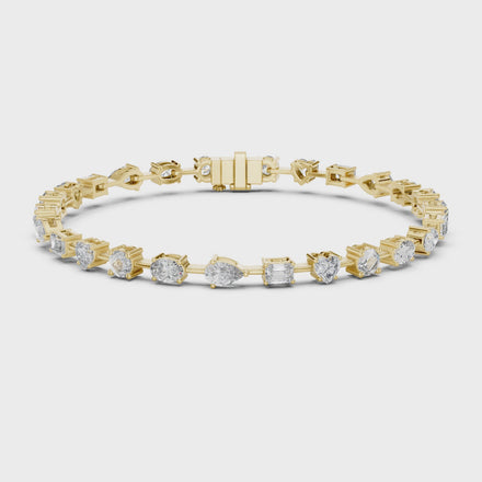 Multi shape lab grown diamond tennis bracelet with round heart oval pear and emerald cut diamonds in gold variations