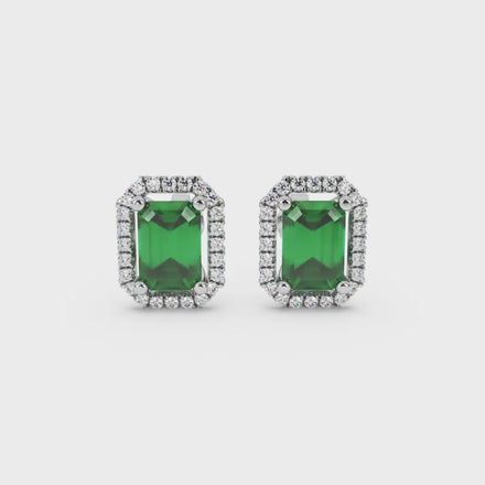 Emerald cut green gemstone halo stud earrings with round diamond accents