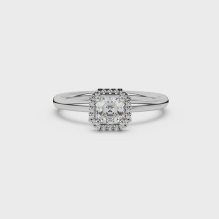 Asscher cut halo gemstone ring in gold featuring a 5.00 MM center gemstone surrounded by round diamond accents