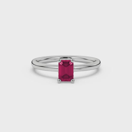 Emerald cut red gemstone halo ring with sparkling round diamond halo in rose gold