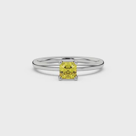 Asscher cut gemstone solitaire ring in gold with four-prong setting