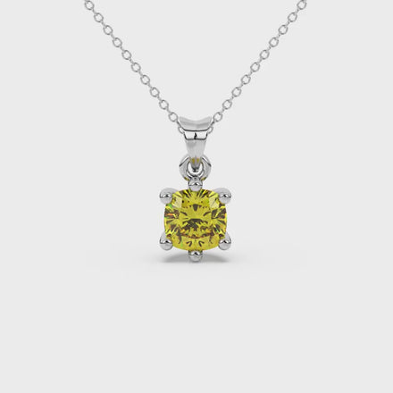 Yellow cushion cut gemstone solitaire pendant in gold featuring a refined six-prong basket setting