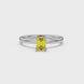 Emerald cut yellow gemstone solitaire ring in gold four prong setting