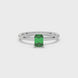 Emerald cut green gemstone solitaire ring in gold four prong setting
