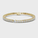 Pear accent lab grown diamond tennis bracelet with round diamonds and central pear cut diamond in gold variations