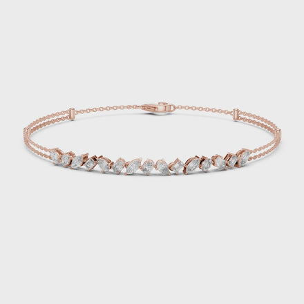 Contemporary multi shape lab grown diamond chain bracelet with pear oval marquise and emerald cut diamonds in yellow white and rose gold
