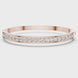 Channel set lab grown diamond bangle bracelet in yellow gold white gold and rose gold with sleek round diamond design