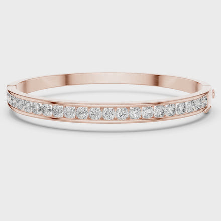 Channel set lab grown diamond bangle bracelet in yellow gold white gold and rose gold with sleek round diamond design