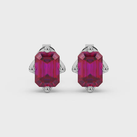 Emerald cut red gemstone stud earrings with elegant open prong design