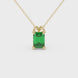 Emerald cut green gemstone solitaire pendant in yellow gold four prong setting