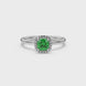 Green cushion cut gemstone halo ring with diamond accents in gold