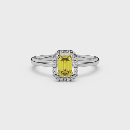 Yellow emerald cut gemstone halo ring with split shank band and diamond accents